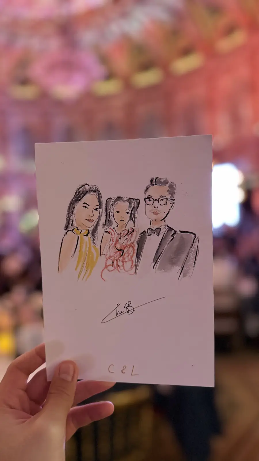 Family portrait in ink and watercolour, held up in the grand reception hall